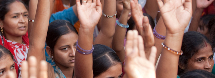 women holding hands up