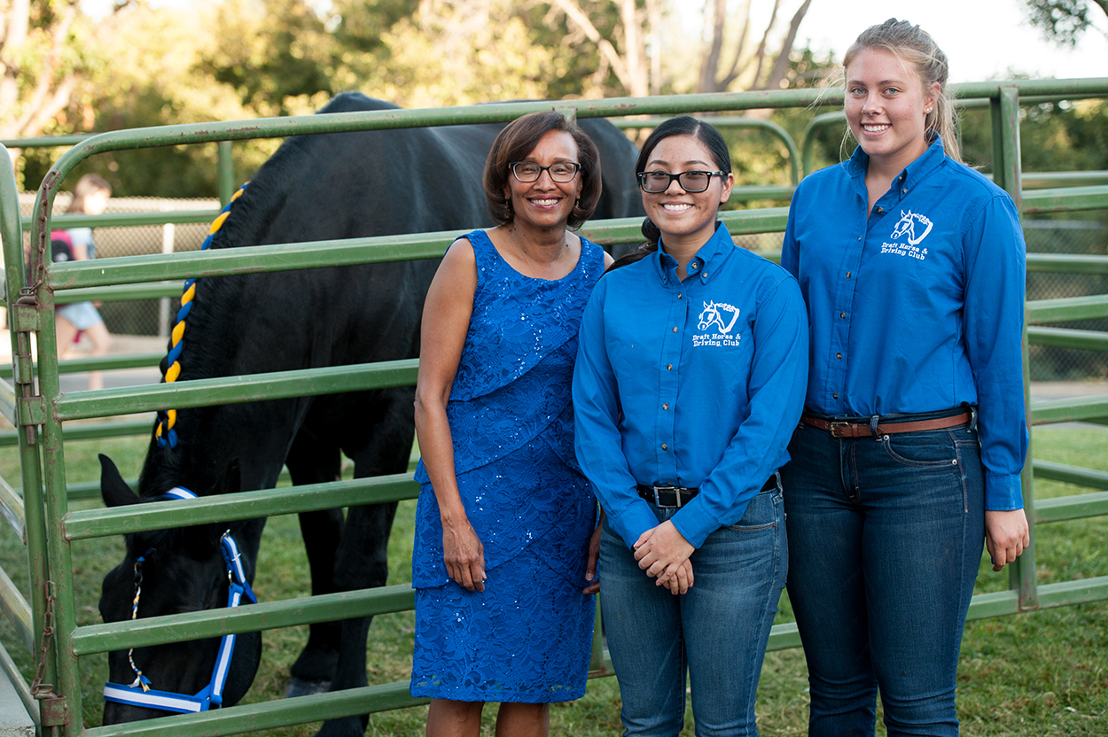 Dean Helene Dillard poses with students from the Draft Horse and Driving Club at the 2017 College Celebration.