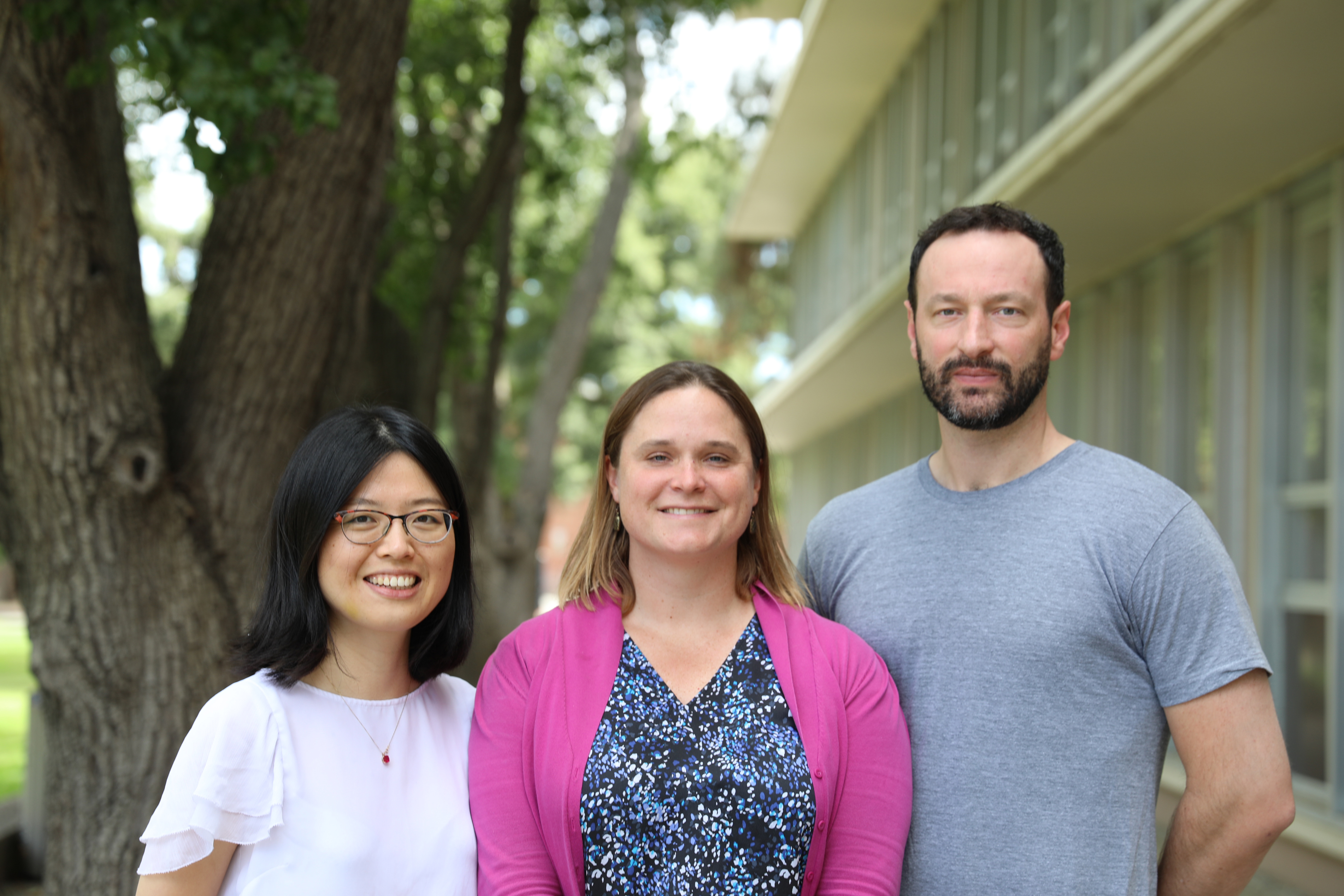 Xiaoli Dong and Frances C. Moore, who are both assistant professors in the Department of Environmental Science and Policy at UC Davis, with Marc N. Conte, an associate professor in the Department of Economics at Fordham University, outside Wickson Hall at UC Davis. (UC Davis Photo)