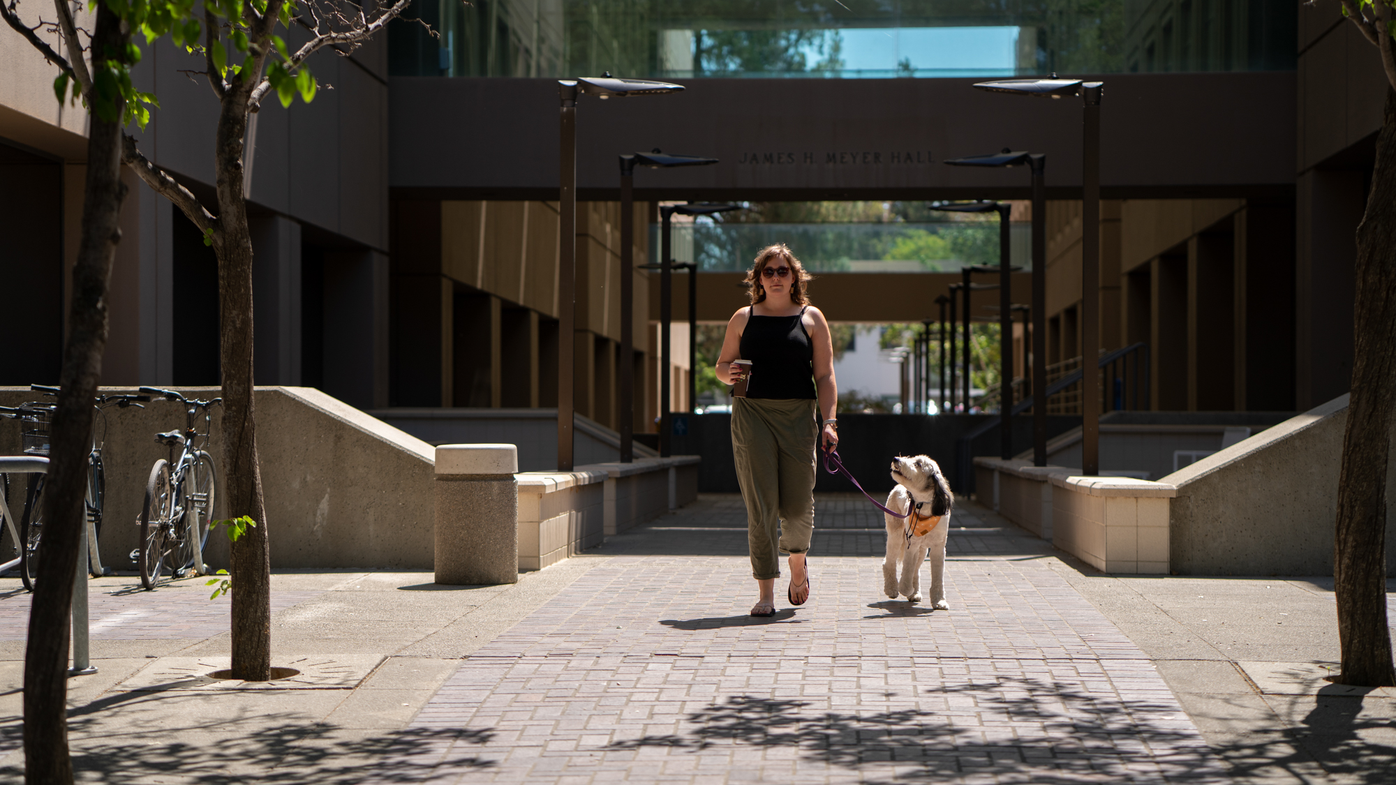Amanda Frazier and dog Maisie take each other for a walk at UC Davis. (Alysha Beck/UC Davis)
