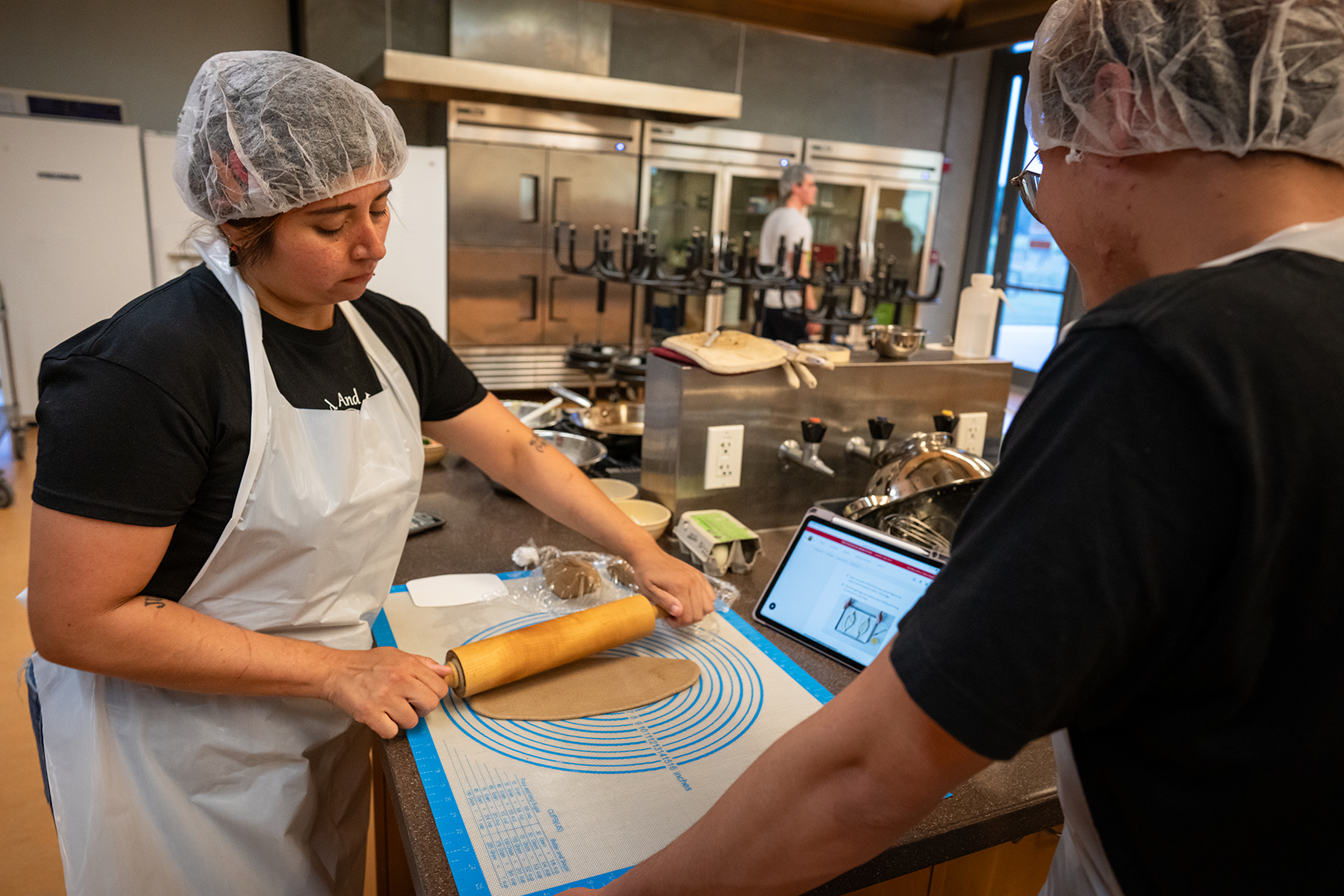 Student rolls out dough for her team’s Khachapuri dish. Photo by: Jael Mackendorf, UC Davis.