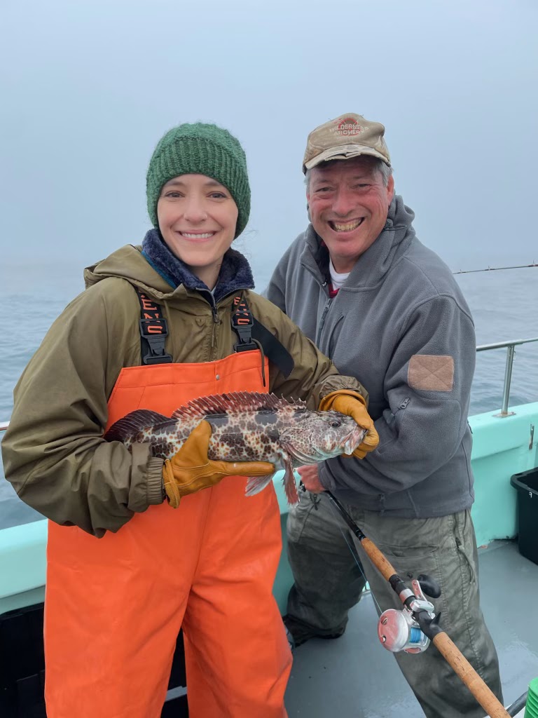 Assistant Professor Christina Pasparakis holding a lingcod while on a research trip with the California Collaborative Fisheries Research Program. (Photo by California Collaborative Fisheries Research Program.)
