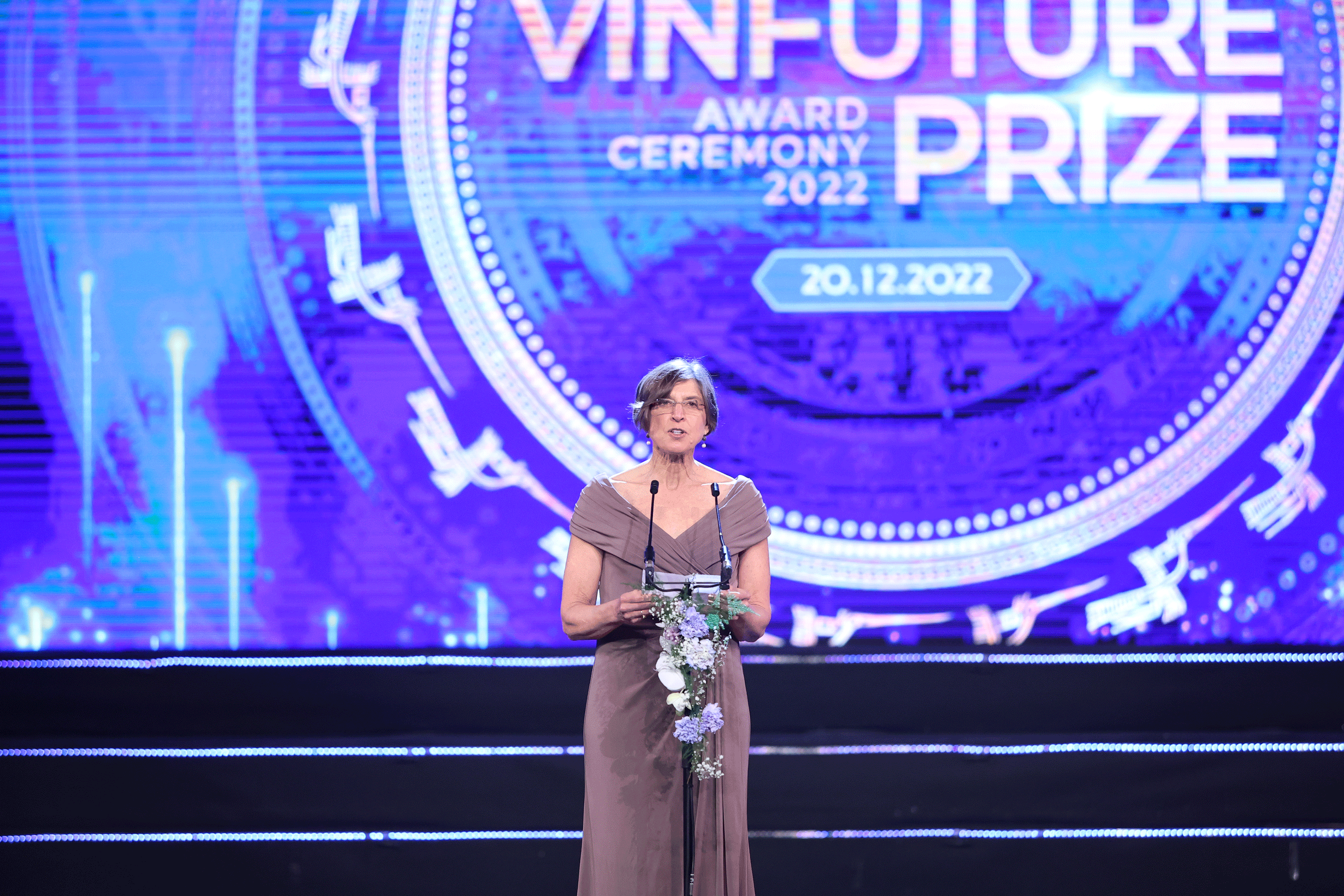 Pam Ronald stands at a podium at ceremony in Hanoi, Vietnam on December 20.
