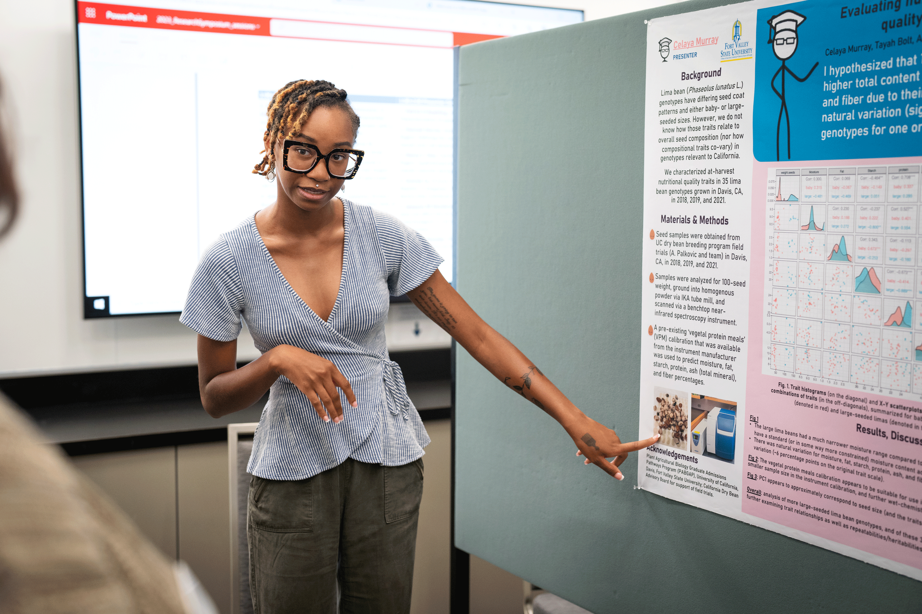 Fort Valley State University student Celaya Murray presenting her research poster during a symposium at the close of the summer session of the Plant Agricultural Biology Graduate Admissions Pathways program. (Jael Mackendorf / UC Davis)
