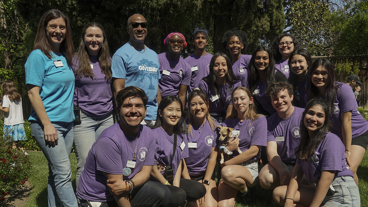 Amanda Portier, back row and second from left, is photographed between Heather Gastellum, ASUCD advisor to Picnic Day, and UC Davis Chancellor Gary S. May and with Picnic Day board members at a reception toward the end of the day. (Karin Higgins/UC Davis)