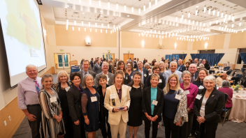 We celebrated several college alumni, friends, faculty and staff at the 2023 annual Award of Distinction reception. Among the awardees, Lisa Nash Holmes, was surrounded by supporters as she accepted her award for Exceptional Staff Member.