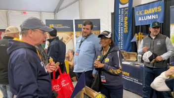 Dean Helene Dillard talks with guests at the UC Davis CA&ES booth during World Ag Expo in Tulare, CA.