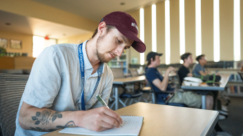 Incoming transfer student Tristin Armstrong takes notes while attending the ARE Microeconomics Math Camp.