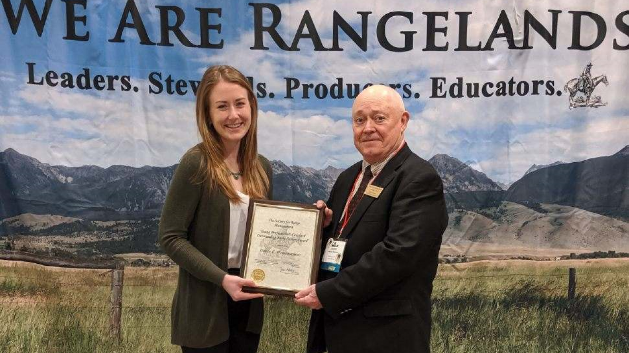 Grace Woodmansee (left), UC Davis graduate student, receives national leadership award from Professor Clayton Marlow, Montana State University, and president of the Society for Range Management