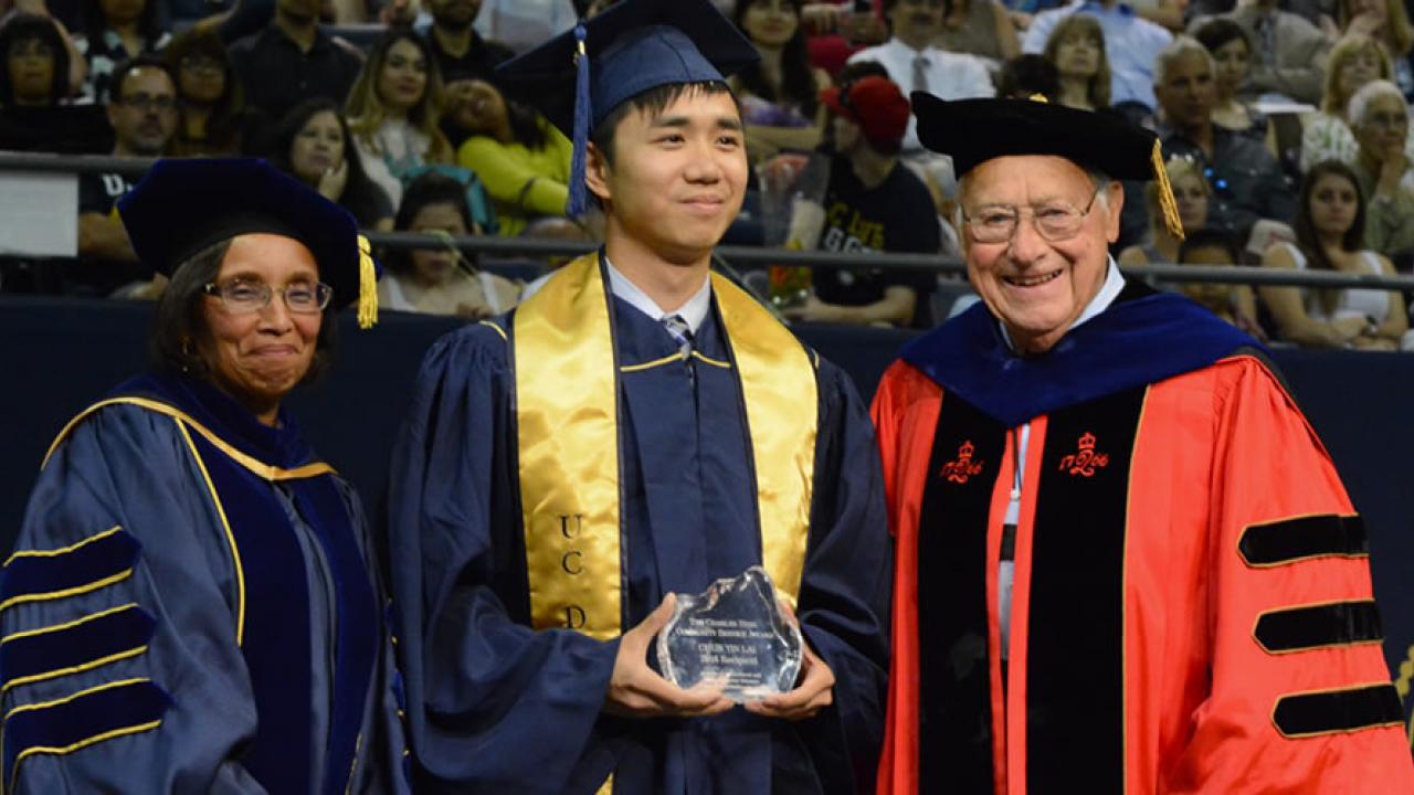 Dean Dillard and Dean Emeritus Hess (in his Rutgers academic regalia) flank Chun Yin “Anson” Lai, recipient of a Charles Hess Community Service Award in 2016.