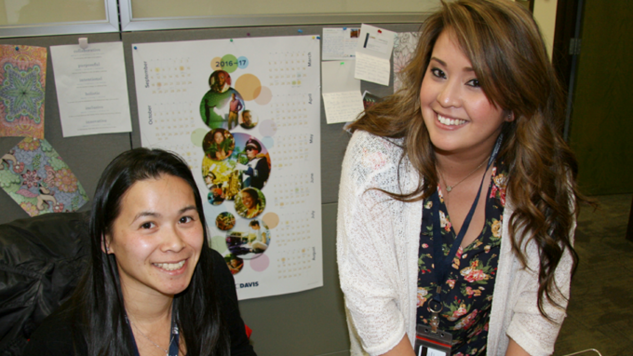 Hong Dao, CA&ES academic advisor (left), works with Katherine Parpana in the CA&ES advising office.