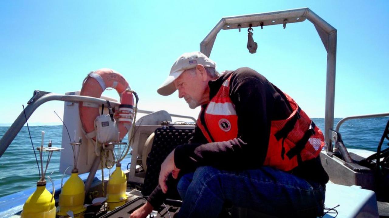 Steven Morgan, professor of UC Davis Department of Environmental Science and the UC Davis Bodega Marine Laboratory, prepares to deploy yellow &quot;robot larvae&quot; off the coast of Bodega Bay, California. Photo: Joe Proudman/UC Davis