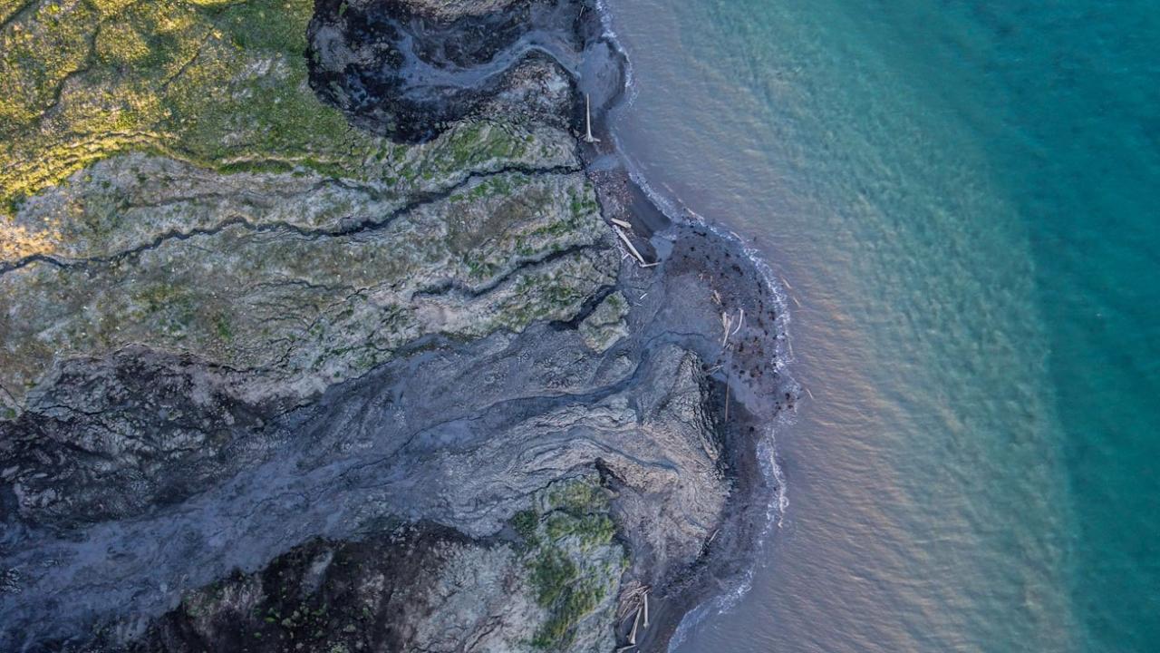 A drone-captured image of a permafrost thaw slump on Qikiqtaruk-Herschel Island in the Canadian Arctic. (Jeffrey Kerby/National Geographic Society)
