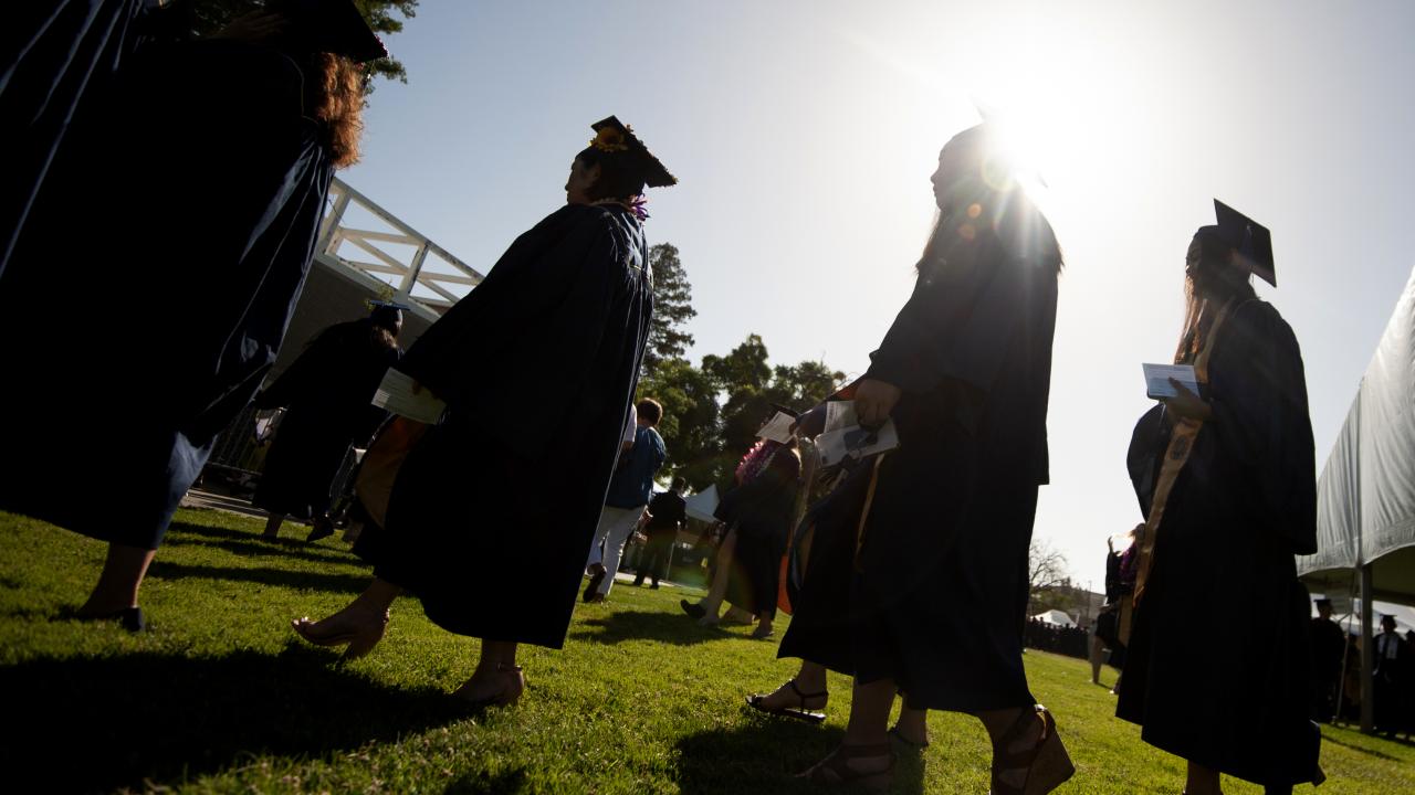 Graduates enter during the College of Agricultural and Environmental Sciences graduation ceremonies.