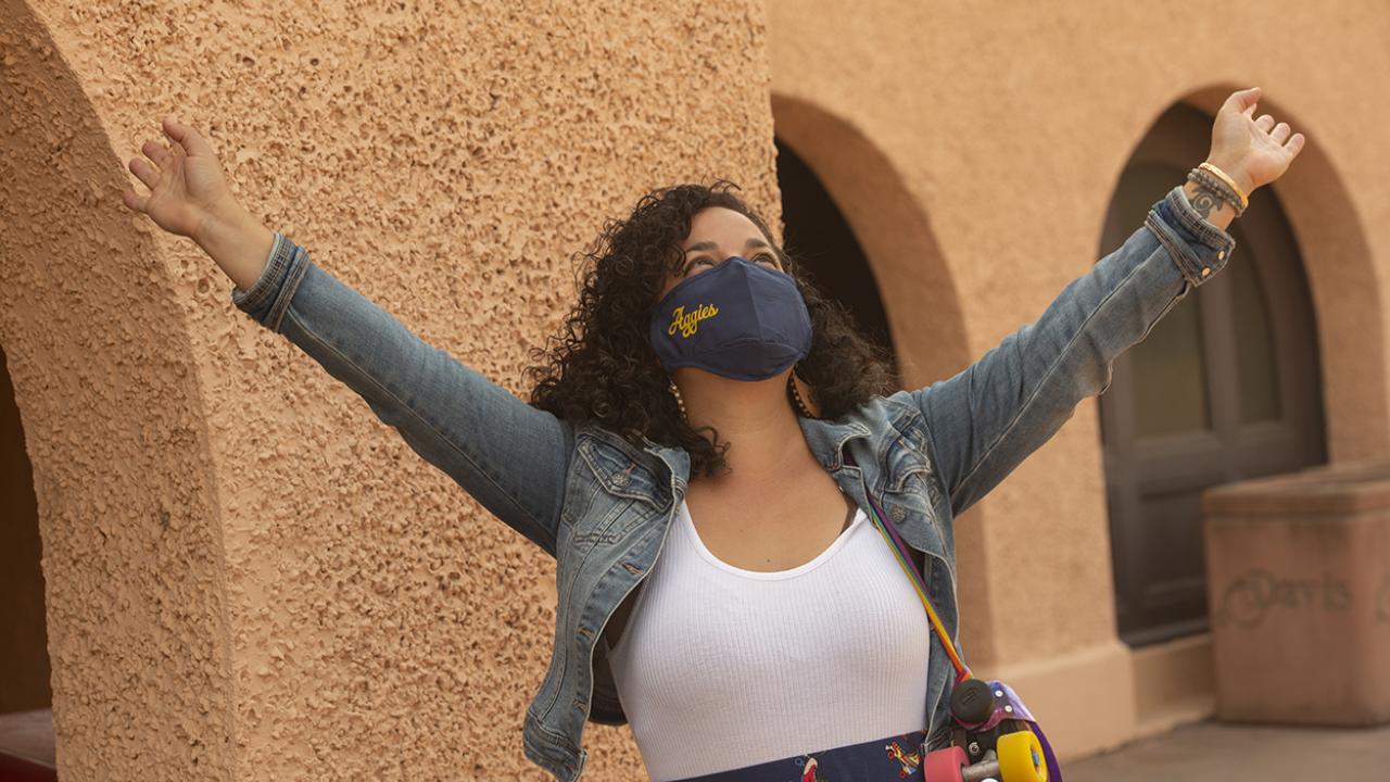 Sequoia Erasmus, a double masters major in Community Developement and Landscape Design, model the new UC Davis branded masks at the Train Station on August 28, 2020. 