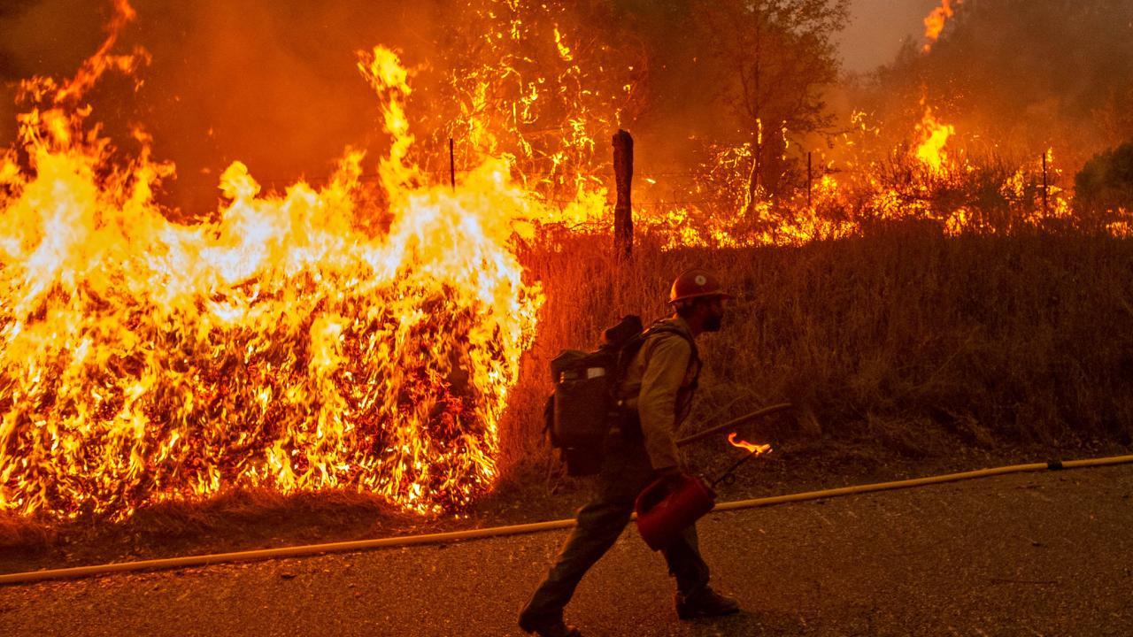 A firefighter helps containment efforts during the Creek Fire response in 2020. (USDA, Pacific Southwest Forest Service)