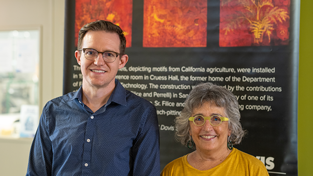 Christopher Simmons and Zann Gates by new display near the California Processing Tomato Industry Pilot Plant at Robert Mondavi Institute complex.