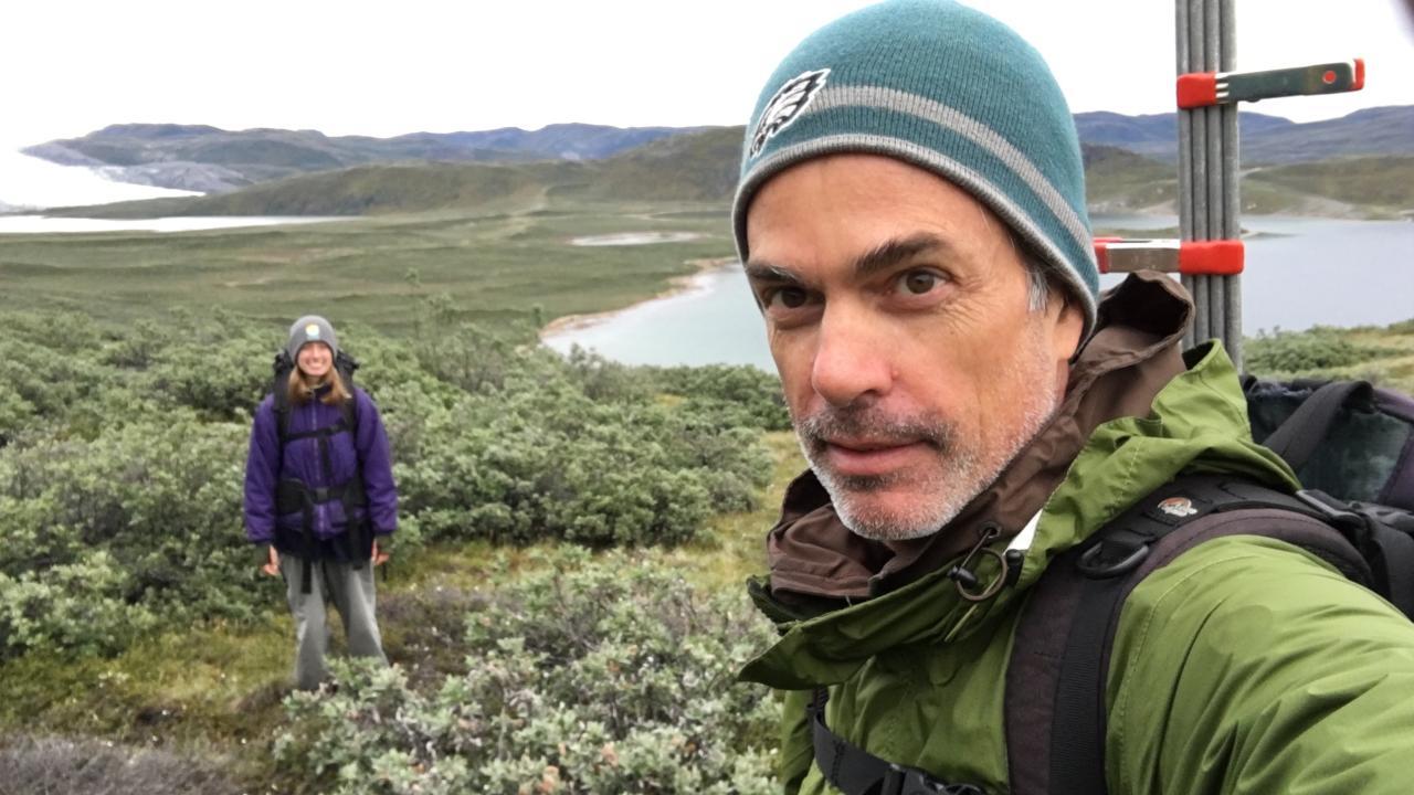 UC Davis polar ecologist Eric Post at his long-term field site in Arctic Greenland with his daughter in the background. (Eric Post/UC Davis)