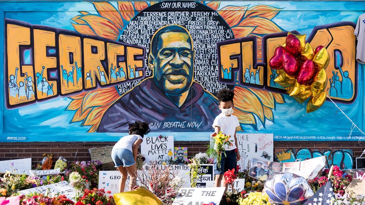 UC Davis alumna Greta McLain joined with Xena Goldman and Cadex Herrera to paint this mural at the intersection where George Floyd died. (Courtesy Lorie Shaull)