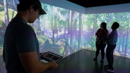 Daniel Schoonbrood, pursuing a master’s degree in food science, uses tablet to control special effects in new sensory room.