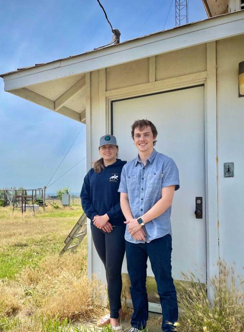 Alexis Clouser and Brody Adams, atmospheric science students at UC Davis, are among the students who rise with the sun to monitor campus weather conditions at the UC Davis weather station. (Tiffany Dobbyn/UC Davis)