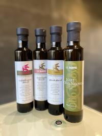 Lined up bottles of olive oil from UC Davis.