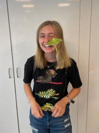 Grace Horne, doctoral student in entomology and organizer of BioBlitz event with a butterfly on her face