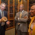Department of Viticulture and Enology Chair David Block (left) visits with UC Davis Chancellor Gary May and College of Agricultural and Environmental Sciences Dean Helene Dillard.