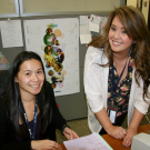 Hong Dao, CA&ES academic advisor (left), works with Katherine Parpana in the CA&ES advising office.