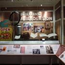 New showcase in the National Museum of American History features UC Davis Professor Emeritus Michael Lewis on a placard, lower right, and his “well-used and beat-up” textbook in the display. (National Museum of American History)