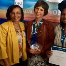 Dean Helene Dillard congratulates Pam Pacelli (center) and Charleen Floyd (right) at the CASE awards conference.
