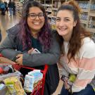 Ruby Bal, left, and Co Hawes are pictured at Trader Joe’s last week, with a shopping cart full of food. They were joined by Layne DeLorme on a grocery run for The Pantry, using the snack money from a canceled event. (Layne DeLorme/UC Davis)