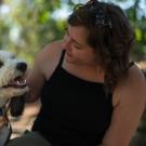 Amanda Frazier, who studies polar fish in Antarctica, gets some snuggles in with her dog, Maisie, at UC Davis in June 2022. (Alysha Beck/UC Davis)