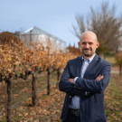 Dario Cantù, a professor in the Department of Viticulture and Enology, in the grape orchard outside the Robert Mondavi Institute for Wine and Food Science. (Jael Mackendorf/UC Davis)
