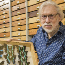 Bill Patterson with butterfly collection.