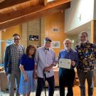 Professor Emeritus Jim Seiber (center) with son Chuck and wife Rita on his left and environmental toxicology chair Robert Rice and CA&ES executive associate dean Ron Tjeerdema on his right.