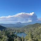 A wildfire smoke plume billows above Castle Lake, near Mount Shasta, on June 29, 2021. (Erin Suenaga/University of Nevada-Reno)